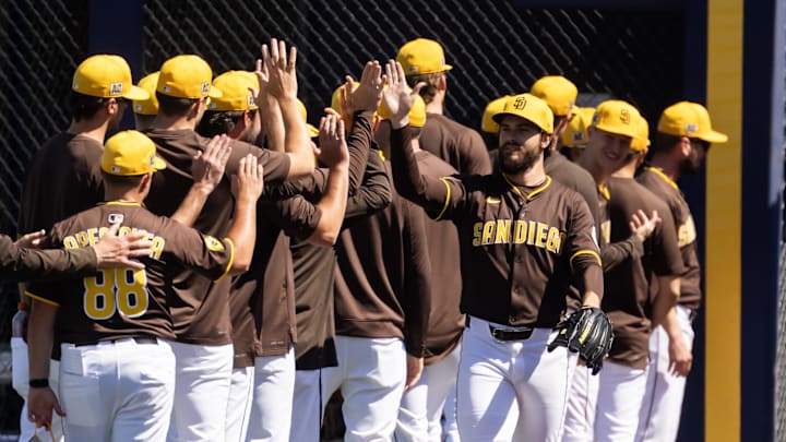 San Diego Padres pitcher Dylan Cease greets teammates against the Chicago White Sox during a spring training game at Peoria Sports Complex on March 11.
