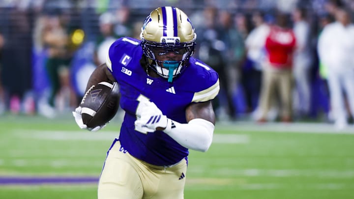 Aug 30, 2025; Seattle, Washington, USA; Washington Huskies running back Jonah Coleman (1) rushes for a touchdown against the Colorado State Rams during the first quarter at Husky Stadium. Mandatory Credit: Joe Nicholson-Imagn Images