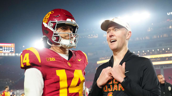 Nov 29, 2025; Los Angeles, California, USA; Southern California Trojans quarterback Jayden Maiava (14) and head coach Lincoln Riley react after the game against the UCLA Bruins at United Airlines Field at Los Angeles Memorial Coliseum. Mandatory Credit: Kirby Lee-Imagn Images Nov 29, 2025; Los Angeles, California, USA; Southern California Trojans quarterback Jayden Maiava (14) and head coach Lincoln Riley react after the game against the UCLA Bruins at United Airlines Field at Los Angeles Memorial Coliseum. Mandatory Credit: Kirby Lee-Imagn Images