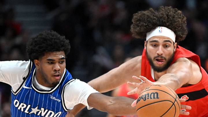 Orlando Magic guard Jase Richardson and Toronto Raptors forward Allen Graves. Orlando Magic guard Jase Richardson and Toronto Raptors forward Allen Graves.