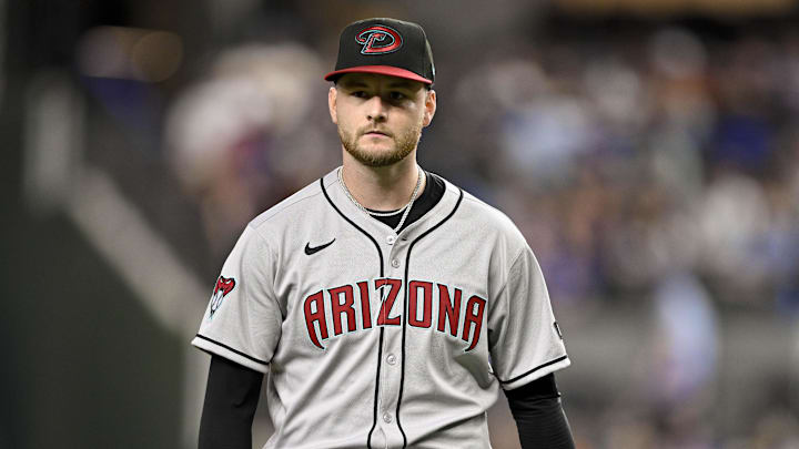 Aug 11, 2025; Arlington, Texas, USA; Arizona Diamondbacks starting pitcher Ryne Nelson (19) comes off the field after he pitches against the Texas Rangers during the third inning at Globe Life Field. Mandatory Credit: Jerome Miron-Imagn Images