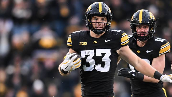 Oct 25, 2025; Iowa City, Iowa, USA; Iowa Hawkeyes linebacker Cam Buffington (33) returns an interception during the fourth quarter against the Minnesota Golden Gophers at Kinnick Stadium. Mandatory Credit: Jeffrey Becker-Imagn Images Oct 25, 2025; Iowa City, Iowa, USA; Iowa Hawkeyes linebacker Cam Buffington (33) returns an interception during the fourth quarter against the Minnesota Golden Gophers at Kinnick Stadium. Mandatory Credit: Jeffrey Becker-Imagn Images