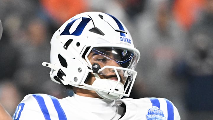 Dec 6, 2025; Charlotte, NC, USA; Duke Blue Devils quarterback Darian Mensah (10) throws in the second quarter against the Virginia Cavaliers during the 2025 ACC Championship game at Bank of America Stadium. Mandatory Credit: Bob Donnan-Imagn Images