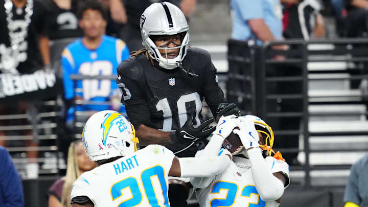 Sep 15, 2025; Paradise, Nevada, USA; Los Angeles Chargers safety Tony Jefferson (23) intercepts a pass intended for Las Vegas Raiders wide receiver Dont'e Thornton Jr. (10) during the second quarter at Allegiant Stadium. Mandatory Credit: Stephen R. Sylvanie-Imagn Images