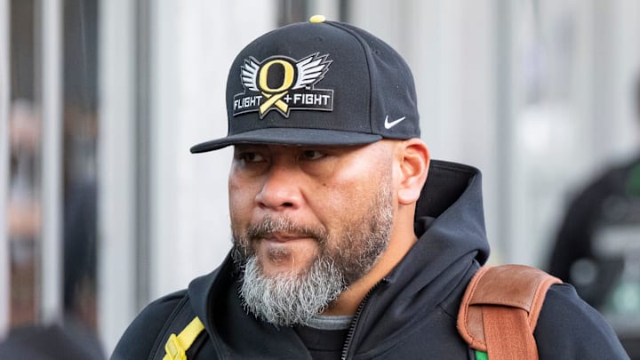 Oregon defensive line coach Tony Tuioti walks into the hotel as the Oregon Ducks arrive in Los Angeles ahead of the Rose Bowl Sunday, Dec. 29, 2024.