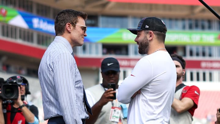 Sep 29, 2024; Tampa, Florida, USA; Fox NFL broadcaster and former NFL quarterback Tom Brady speaks to Tampa Bay Buccaneers quarterback Baker Mayfield (6) before a game against the Philadelphia Eagles at Raymond James Stadium. Mandatory Credit: Nathan Ray Seebeck-Imagn Images Sep 29, 2024; Tampa, Florida, USA; Fox NFL broadcaster and former NFL quarterback Tom Brady speaks to Tampa Bay Buccaneers quarterback Baker Mayfield (6) before a game against the Philadelphia Eagles at Raymond James Stadium. Mandatory Credit: Nathan Ray Seebeck-Imagn Images