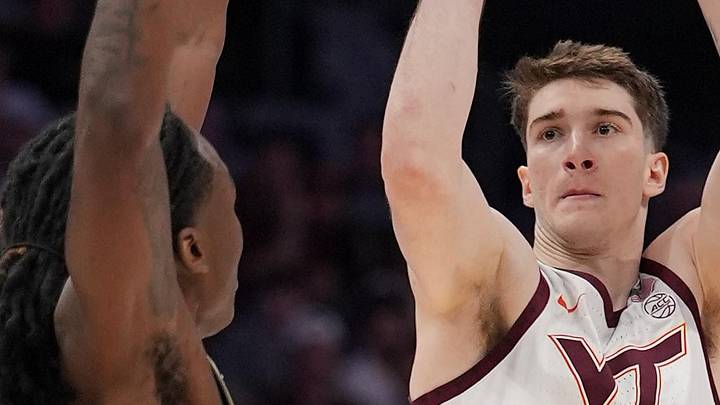 Mar 10, 2026; Charlotte, NC, USA; Virginia Tech Hokies guard Neoklis Avdalas (17) shoots a three point basket against Wake Forest Demon Deacons forward Tre'von Spillers (25) during the first half at Spectrum Center. Mandatory Credit: Jim Dedmon-Imagn Images