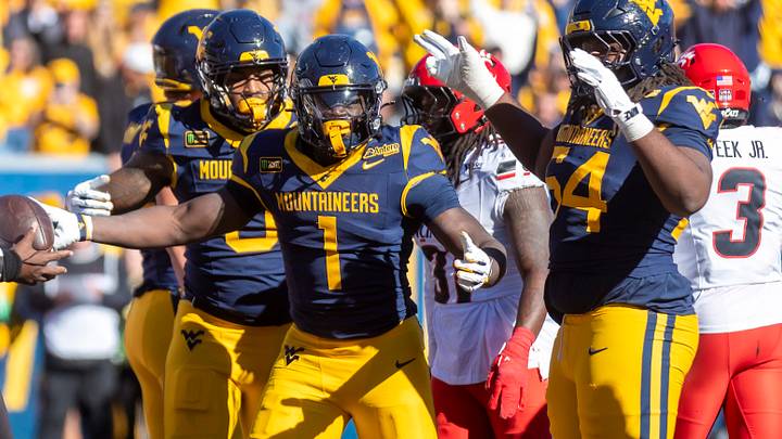 Oct 17, 2026; Morgantown, West Virginia, USA; West Virginia Mountaineers running back Amari Latimer (1) celebrates after scoring a touchdown during the fourth quarter against the Cincinnati Bearcats at Milan Puskar Stadium. Mandatory Credit: Ben Queen-Imagn Images Oct 17, 2026; Morgantown, West Virginia, USA; West Virginia Mountaineers running back Amari Latimer (1) celebrates after scoring a touchdown during the fourth quarter against the Cincinnati Bearcats at Milan Puskar Stadium. Mandatory Credit: Ben Queen-Imagn Images