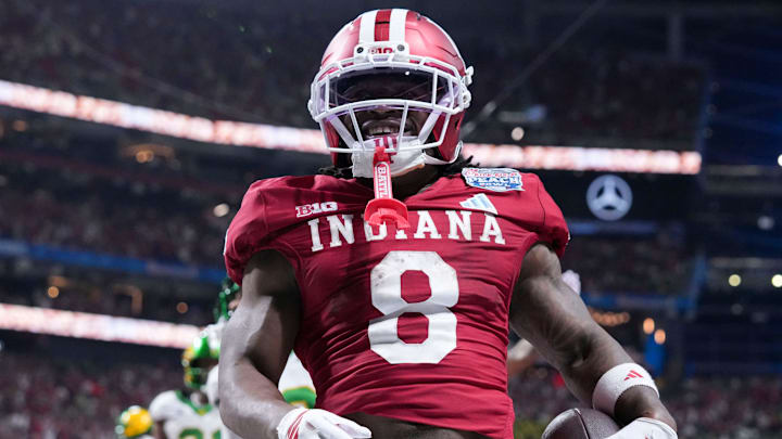 Indiana Hoosiers running back Kaelon Black (8) celebrates after rushing in a touchdown Friday, Jan. 9, 2026, during the Peach Bowl and semifinal game of the College Football Playoff against the Oregon Ducks at Mercedes-Benz Stadium in Atlanta.