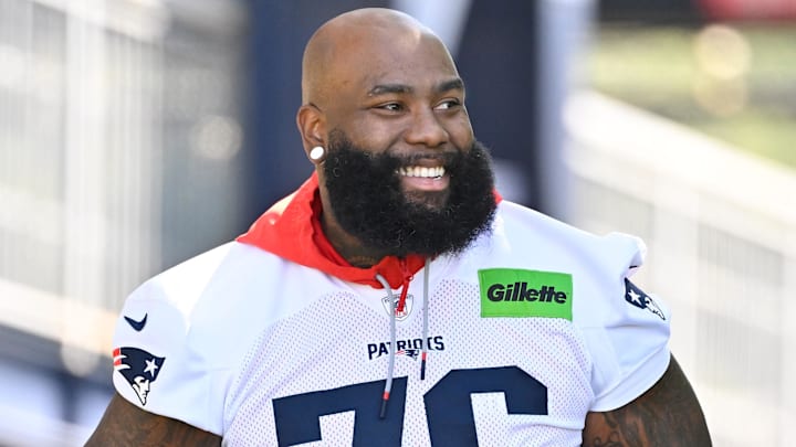Jul 23, 2025; Foxborough, MA, USA; New England Patriots offensive tackle Morgan Moses (76) walks to the practice field for training camp at Gillette Stadium. Mandatory Credit: Eric Canha-Imagn Images