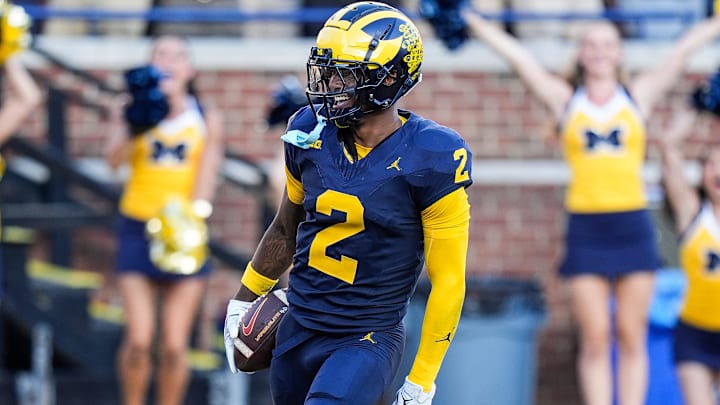 Michigan defensive back Will Johnson celebrates a touchdown after intercepting USC quarterback Miller Moss during the second half at Michigan Stadium in Ann Arbor on Saturday, Sept. 21, 2024.