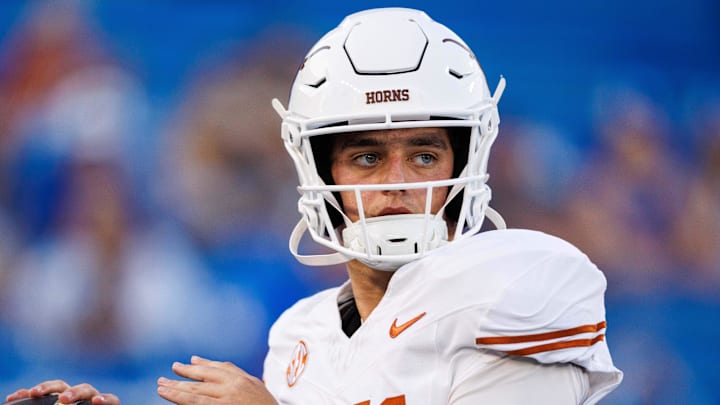 Texas Longhorns quarterback Arch Manning warms up before the game against the Kentucky Wildcats at Kroger Field.