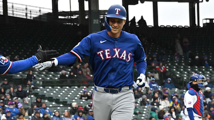 Apr 9, 2025; Chicago, Illinois, USA; Texas Rangers shortstop Corey Seager (right) celebrates his home run with right fielder Adolis Garcia (left) during the first inning at Wrigley Field. Apr 9, 2025; Chicago, Illinois, USA; Texas Rangers shortstop Corey Seager (right) celebrates his home run with right fielder Adolis Garcia (left) during the first inning at Wrigley Field.