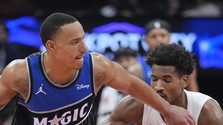 Orlando Magic guard Desmond Bane controls the ball against Toronto Raptors forward Ochai Agbaji.