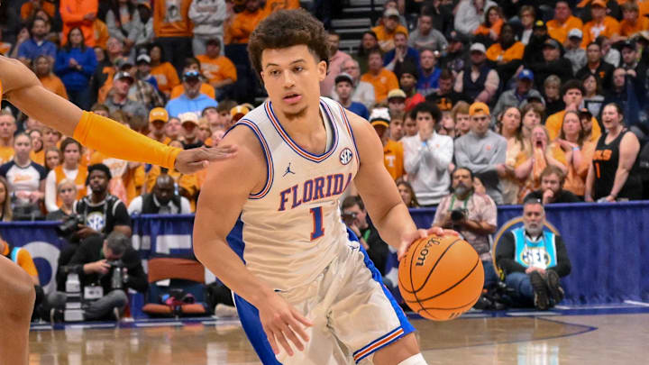 Mar 16, 2025; Nashville, TN, USA; Florida Gators guard Walter Clayton Jr. (1) drives to the basket past Tennessee Volunteers guard Jordan Gainey (11) during the second half at the 2025 SEC Championship Game at Bridgestone Arena. Mandatory Credit: Steve Roberts-Imagn Images Mar 16, 2025; Nashville, TN, USA; Florida Gators guard Walter Clayton Jr. (1) drives to the basket past Tennessee Volunteers guard Jordan Gainey (11) during the second half at the 2025 SEC Championship Game at Bridgestone Arena. Mandatory Credit: Steve Roberts-Imagn Images