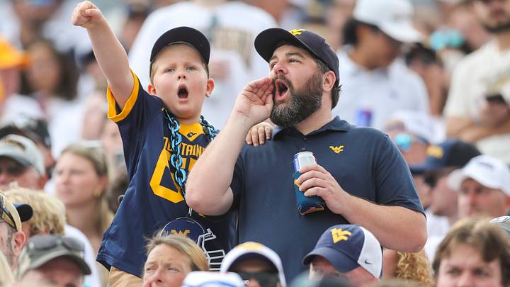 Sep 5, 2026; Morgantown, West Virginia, USA; West Virginia Mountaineers fans cheer during the first quarter against the Coastal Carolina Chanticleers at Milan Puskar Stadium. Mandatory Credit: Ben Queen-Imagn Images Sep 5, 2026; Morgantown, West Virginia, USA; West Virginia Mountaineers fans cheer during the first quarter against the Coastal Carolina Chanticleers at Milan Puskar Stadium. Mandatory Credit: Ben Queen-Imagn Images
