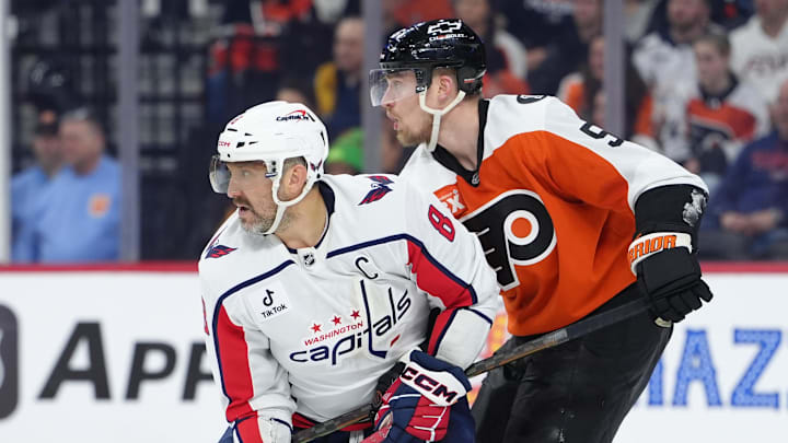 Mar 11, 2026; Philadelphia, Pennsylvania, USA; Washington Capitals left wing Alex Ovechkin (8) battles for position against Philadelphia Flyers defenseman Rasmus Ristolainen (55) in the third period at Xfinity Mobile Arena. Mandatory Credit: Kyle Ross-Imagn Images
