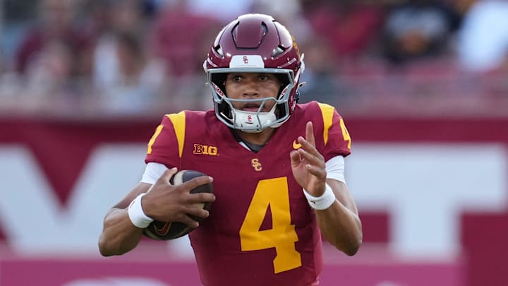 Aug 30, 2025; Los Angeles, California, USA; Southern California Trojans quarterback Husan Longstreet (4) carries the ball against the Missouri State Bears in the second half at United Airlines Field at Los Angeles Memorial Coliseum. Mandatory Credit: Kirby Lee-Imagn Images Aug 30, 2025; Los Angeles, California, USA; Southern California Trojans quarterback Husan Longstreet (4) carries the ball against the Missouri State Bears in the second half at United Airlines Field at Los Angeles Memorial Coliseum. Mandatory Credit: Kirby Lee-Imagn Images