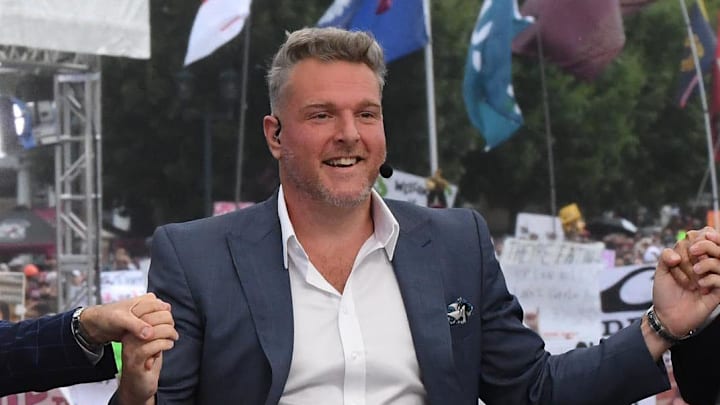 Desmond Howard, left, Rece Davis, Pat McAfee hold hands for a photo before starting live broadcast during ESPN Gameday near Williams-Brice Stadium in Columbia, S.C.Saturday, September 14, 2024.