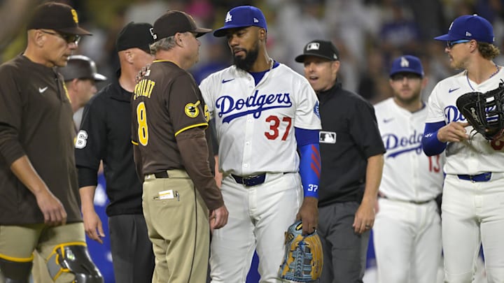 San Diego Padres manager Mike Shildt (8) talks with Los Angeles Dodgers right fielder Teoscar Hernandez (37) as play is about to resume after benches cleared in the eighth inning at Dodger Stadium on June 19, 2025.