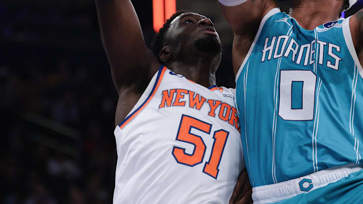 Oct 17, 2025; New York, New York, USA; Charlotte Hornets forward Miles Bridges (0) drives to the basket as New York Knicks forward Mohamed Diawara (51) defends during the first half at Madison Square Garden. Mandatory Credit: Vincent Carchietta-Imagn Images