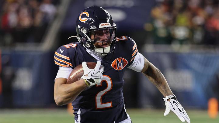 Dec 20, 2025; Chicago, Illinois, USA; Chicago Bears wide receiver DJ Moore (2) runs after the catch against Green Bay Packers guard Lecitus Smith (68) during the first quarter at Soldier Field. Mandatory Credit: Mike Dinovo-Imagn Images