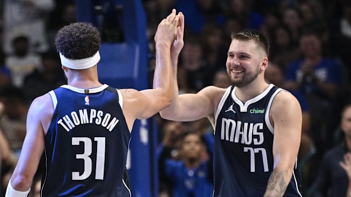 Oct 24, 2024; Dallas, Texas, USA; Dallas Mavericks guard Klay Thompson (31) and guard Luka Doncic (77) celebrate during the second half against the San Antonio Spurs at the American Airlines Center. Mandatory Credit: Jerome Miron-Imagn Images