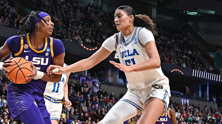 Mar 30, 2025; Spokane, WA, USA; LSU Lady Tigers forward Sa'Myah Smith (5) gets the loose ball against
UCLA Bruins center Lauren Betts (51) during the second half of a Elite 8 NCAA Tournament basketball game at Spokane Arena. Mandatory Credit: James Snook-Imagn Images Mar 30, 2025; Spokane, WA, USA; LSU Lady Tigers forward Sa'Myah Smith (5) gets the loose ball against
UCLA Bruins center Lauren Betts (51) during the second half of a Elite 8 NCAA Tournament basketball game at Spokane Arena. Mandatory Credit: James Snook-Imagn Images
