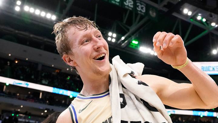 Milwaukee Bucks guard AJ Green (20) reacts after being doused with water following the game against the Brooklyn Nets at Fiserv Forum on April 10, 2026.