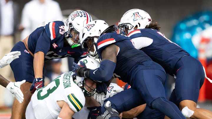 Nov 22, 2025; Tucson, Arizona, USA; Baylor Bears quarterback Sawyer Robertson (13) is tackled by the Arizona Wildcats in the first half at Casino Del Sol Stadium. Mandatory Credit: Mark J. Rebilas-Imagn Images