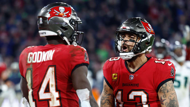Nov 13, 2022; Munich, Germany, DEU; Tampa Bay Buccaneers wide receiver Chris Godwin (14) celebrates his touchdown with teammate wide receiver Mike Evans (13) against the Seattle Seahawks during the fourth quarter of an International Series game at Allianz Arena. Mandatory Credit: Douglas DeFelice-Imagn Images