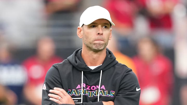 Oct 5, 2025; Glendale, Arizona, USA; Arizona Cardinals head coach Jonathan Gannon stands on the field before their game against the Tennessee Titans at State Farm Stadium. Mandatory Credit: Joe Camporeale-Imagn Images