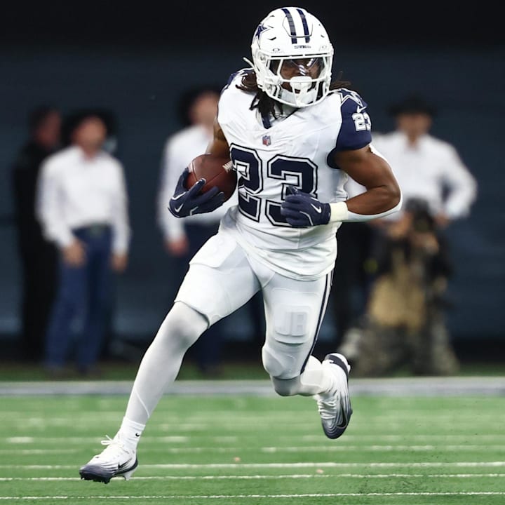 Dallas Cowboys running back Jaydon Blue carries the ball against the Washington Commanders.