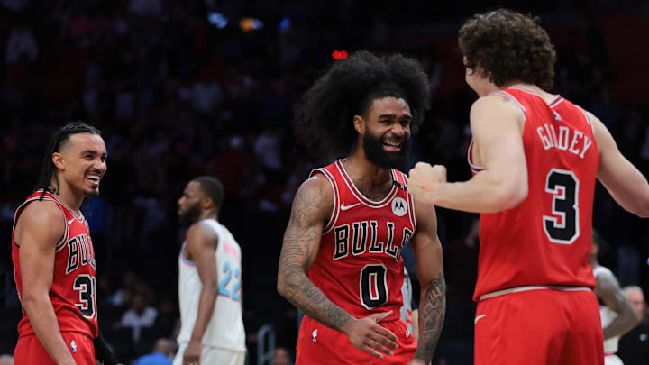 Mar 8, 2025; Miami, Florida, USA; Chicago Bulls guard Coby White (0) celebrates with guard Josh Giddey (3) after the game against the Miami Heat at Kaseya Center. Mandatory Credit: Sam Navarro-Imagn Images