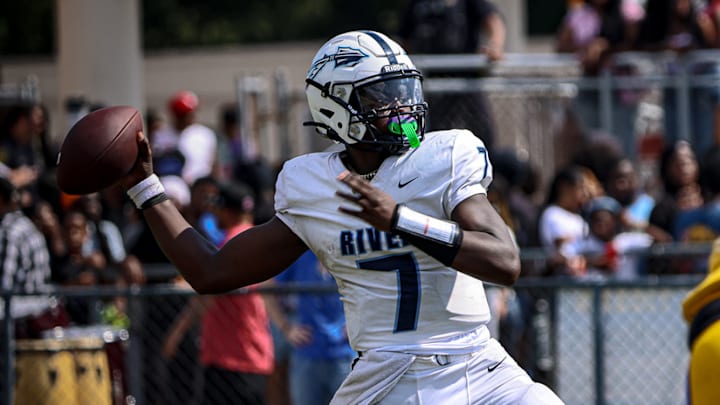 Lord Malik Heru delivers a strike from the pocket against Oscar Smith High School