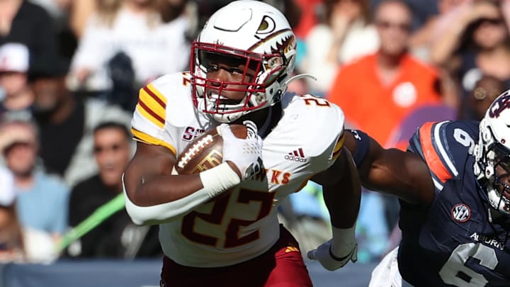 Nov 16, 2024; Auburn, Alabama, USA; Louisiana Monroe Warhawks running back Ahmad Hardy (22) avoids the tackle of Auburn Tigers linebacker Austin Keys (6) during the second quarter at Jordan-Hare Stadium. Mandatory Credit: John Reed-Imagn Images Nov 16, 2024; Auburn, Alabama, USA; Louisiana Monroe Warhawks running back Ahmad Hardy (22) avoids the tackle of Auburn Tigers linebacker Austin Keys (6) during the second quarter at Jordan-Hare Stadium. Mandatory Credit: John Reed-Imagn Images