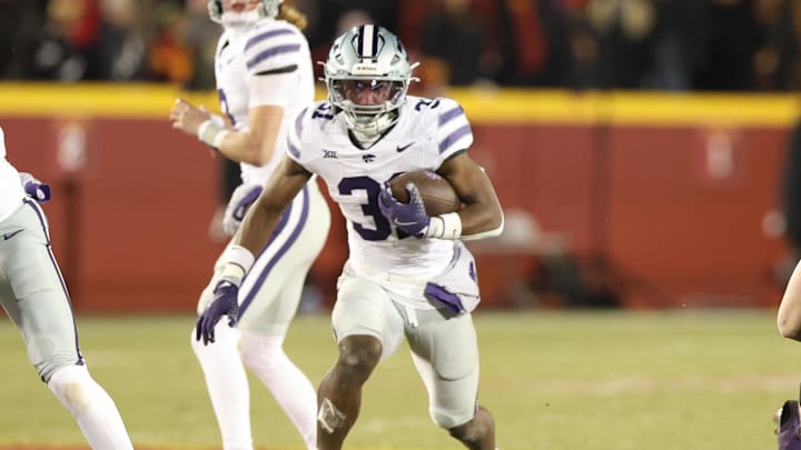 Nov 30, 2024; Ames, Iowa, USA; Kansas State Wildcats running back DJ Giddens (31) runs the football against the Iowa State Cyclones in the first quarter at at Jack Trice Stadium. Mandatory Credit: Reese Strickland-Imagn Images Nov 30, 2024; Ames, Iowa, USA; Kansas State Wildcats running back DJ Giddens (31) runs the football against the Iowa State Cyclones in the first quarter at at Jack Trice Stadium. Mandatory Credit: Reese Strickland-Imagn Images