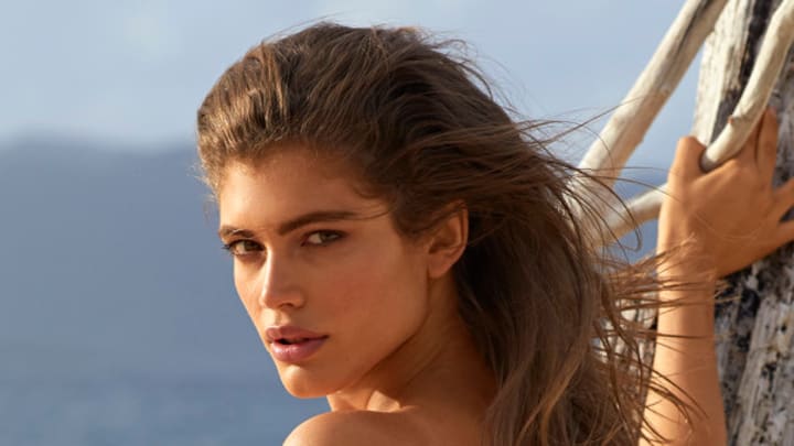 Valentina Sampaio was photographed by Josie Clough in Scrub Island, BVI. Swimsuit by HAUS OF PINK LEMONAID.