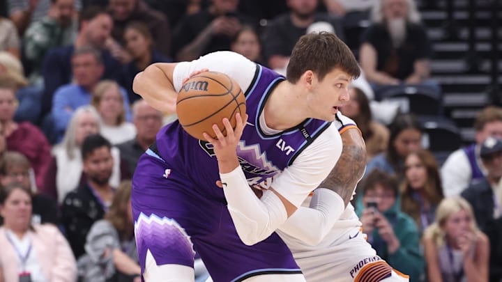 Oct 27, 2025; Salt Lake City, Utah, USA; Utah Jazz center Walker Kessler (24) posts up against Phoenix Suns center Nick Richards (2) during the second quarter at Delta Center. Mandatory Credit: Rob Gray-Imagn Images