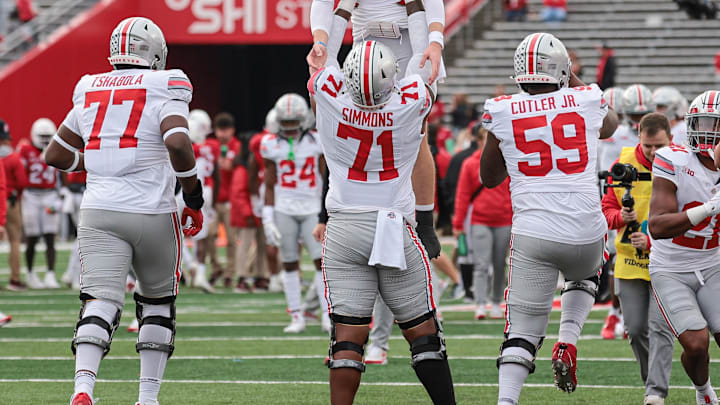 Nov 4, 2023; Piscataway, New Jersey, USA; Ohio State Buckeyes offensive lineman Josh Simmons (71) and quarterback Kyle McCord (6) prepare for the game against the Rutgers Scarlet Knights at SHI Stadium. Mandatory Credit: Vincent Carchietta-Imagn Images