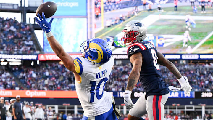 Nov 17, 2024; Foxborough, Massachusetts, USA; Los Angeles Rams wide receiver Cooper Kupp (10) is unable to complete a pass thrown by quarterback Matthew Stafford (not seen) during the first half of a game against the New England Patriots at Gillette Stadium. Mandatory Credit: Brian Fluharty-Imagn Images