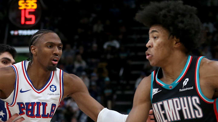 Memphis Grizzlies forward Jaylen Wells dribbles as Philadelphia 76ers guard Tyrese Maxey defends.