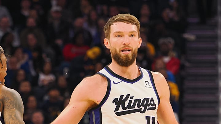 Jan 5, 2025; San Francisco, California, USA; Sacramento Kings center Domantas Sabonis (11) high fives forward/guard DeMar DeRozan (10) after scoring a basket against the Golden State Warriors during the second quarter at Chase Center.