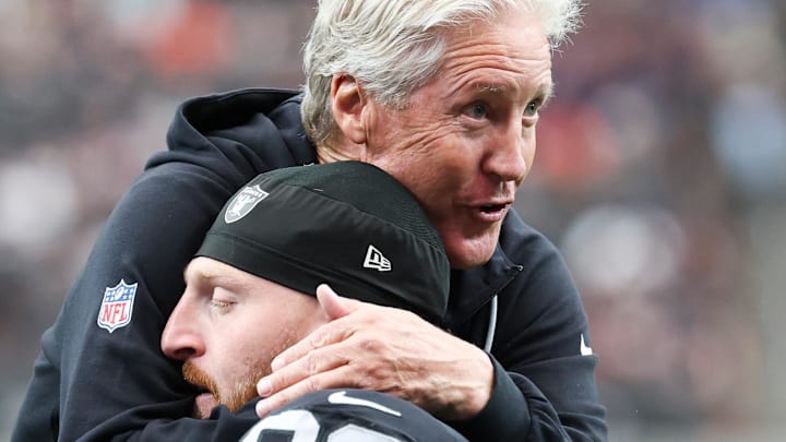 Sep 28, 2025; Paradise, Nevada, USA; Las Vegas Raiders defensive end Maxx Crosby (98) hugs head coach Pete Carroll prior to the game against the Chicago Bears at Allegiant Stadium. Mandatory Credit: Kiyoshi Mio-Imagn Images