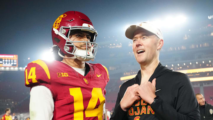 Nov 29, 2025; Los Angeles, California, USA; Southern California Trojans quarterback Jayden Maiava (14) and head coach Lincoln Riley react after the game against the UCLA Bruins at United Airlines Field at Los Angeles Memorial Coliseum. Mandatory Credit: Kirby Lee-Imagn Images Nov 29, 2025; Los Angeles, California, USA; Southern California Trojans quarterback Jayden Maiava (14) and head coach Lincoln Riley react after the game against the UCLA Bruins at United Airlines Field at Los Angeles Memorial Coliseum. Mandatory Credit: Kirby Lee-Imagn Images