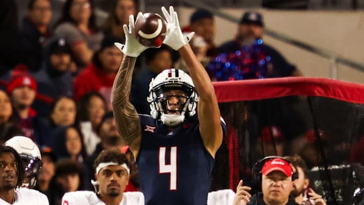 Nov 15, 2024; Tucson, Arizona, USA; Arizona Wildcats wide receiver Tetairoa McMillan (4) catches the ball during the third quarter against the Houston Cougars at Arizona Stadium. Mandatory Credit: Aryanna Frank-Imagn Images