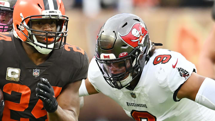 Nov 27, 2022; Cleveland, Ohio, USA; Cleveland Browns running back Nick Chubb (24) runs with the ball as Tampa Bay Buccaneers linebacker Joe Tryon-Shoyinka (9) pursues during the first half at FirstEnergy Stadium. Mandatory Credit: Ken Blaze-Imagn Images