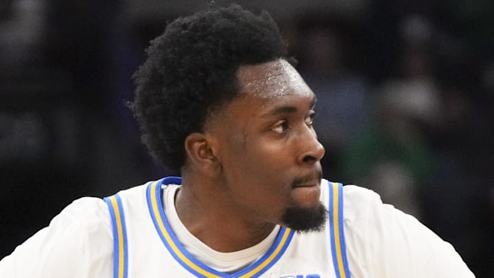 Mar 14, 2026; Chicago, IL, USA; UCLA Bruins center Xavier Booker (1) reacts after making a three point basket against the Purdue Boilermakers during the first half at United Center. Mandatory Credit: David Banks-Imagn Images