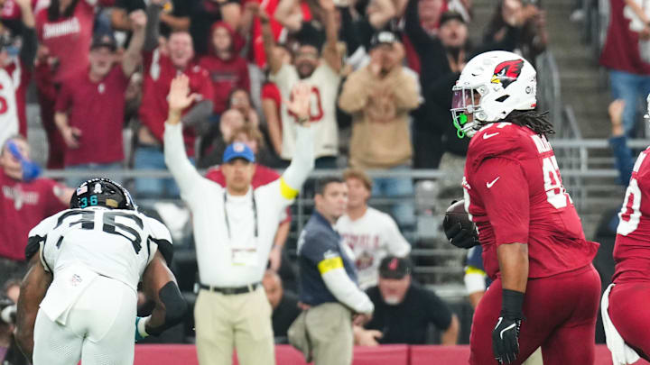 Nov 23, 2025; Glendale, Arizona, USA;  Arizona Cardinals defensive tackle Walter Nolen III (97) returns a fumble for a touchdown during the first quarter against the Jacksonville Jaguars at State Farm Stadium. Mandatory Credit: Joe Camporeale-Imagn Images
