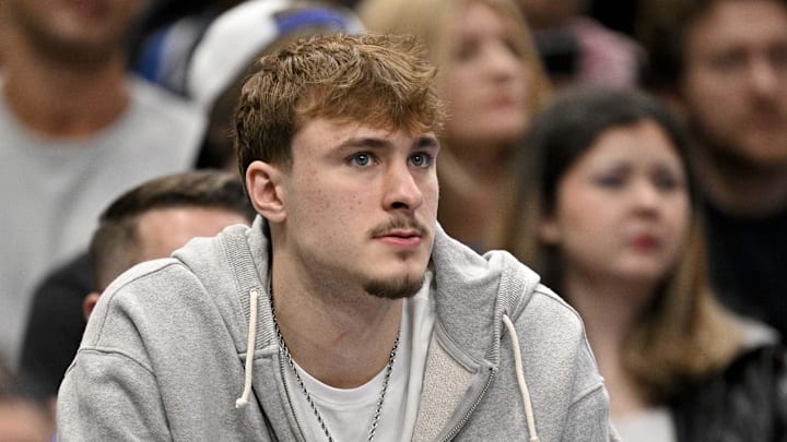 Feb 27, 2026; Dallas, Texas, USA; Dallas Mavericks forward Cooper Flagg looks on from the team bench during the second half against the Memphis Grizzlies at the American Airlines Center. Mandatory Credit: Jerome Miron-Imagn Images